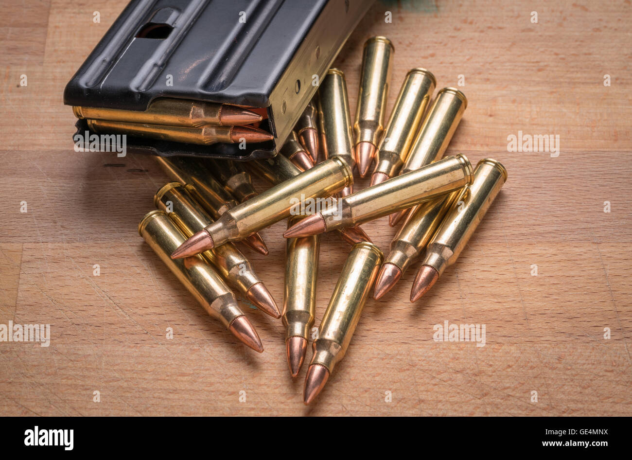 Ammunition in Magazine .223/556 on wood Surface Stock Photo