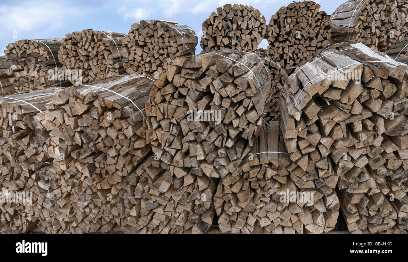 Stacked round bundles of wood Stock Photo Alamy