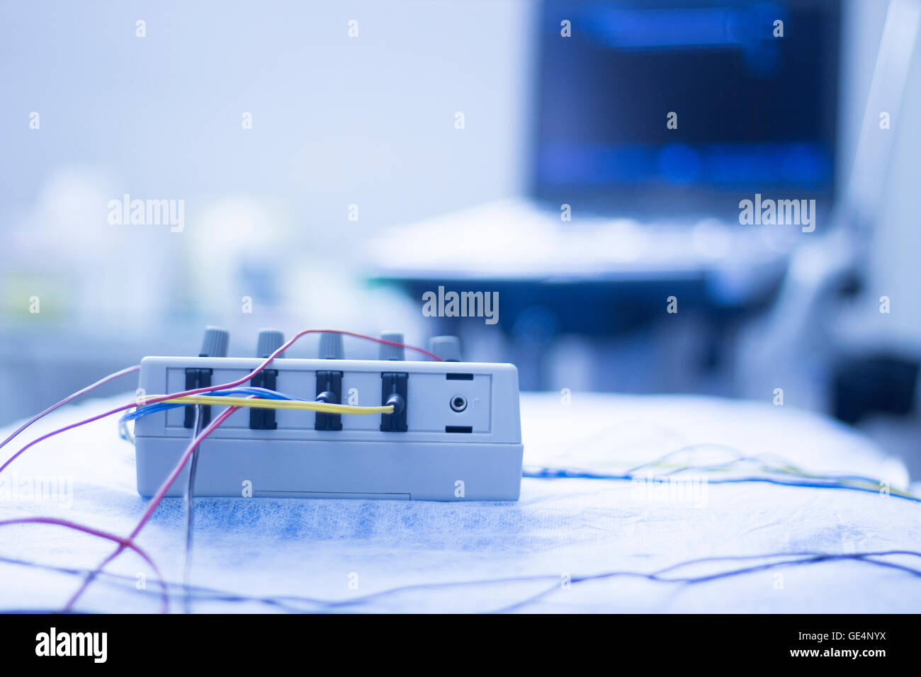 Dry needling electroacupunture cables connecting machine to needles used by acupunturist on