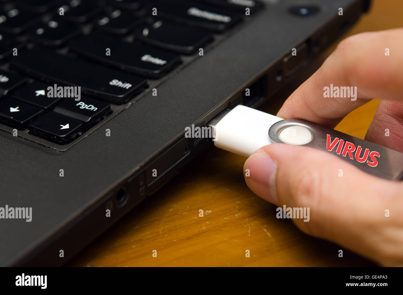 IT virus enter laptop computer via USB thumb drive Stock Photo - Alamy