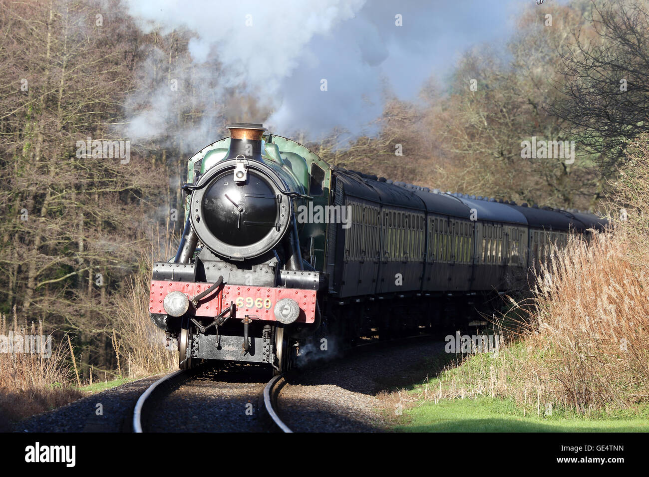 Modified Hall class steam locomotive 6960 'Ravingham Hall' pulling a train on the West Somerset Railway, England, UK. Stock Photo