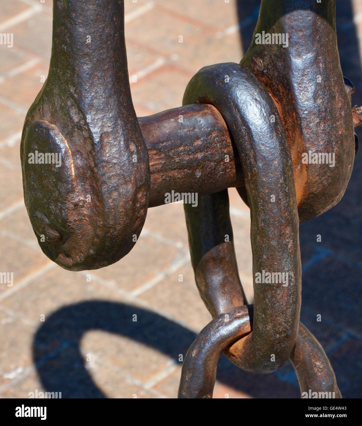 Abstract closeup of rusted metal ship anchor with chain link in outdoor ...