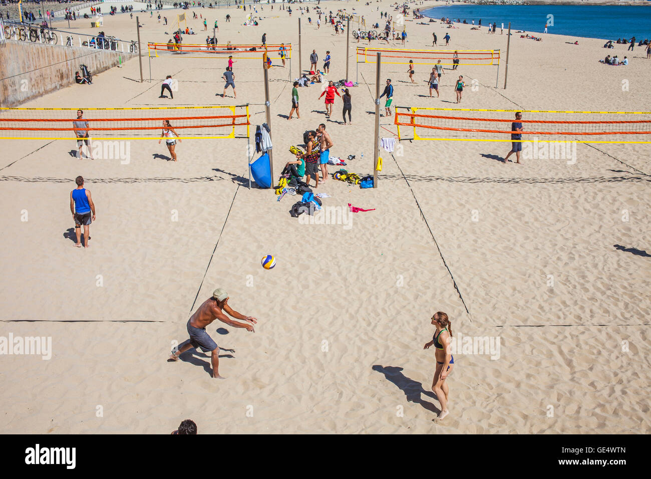 people playing volleyball,in Nova Icària beach, Barcelona, Spain Stock