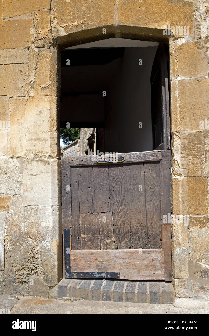 Old oak gate entrance to private houses Chipping Campden Cotswolds UK Stock Photo