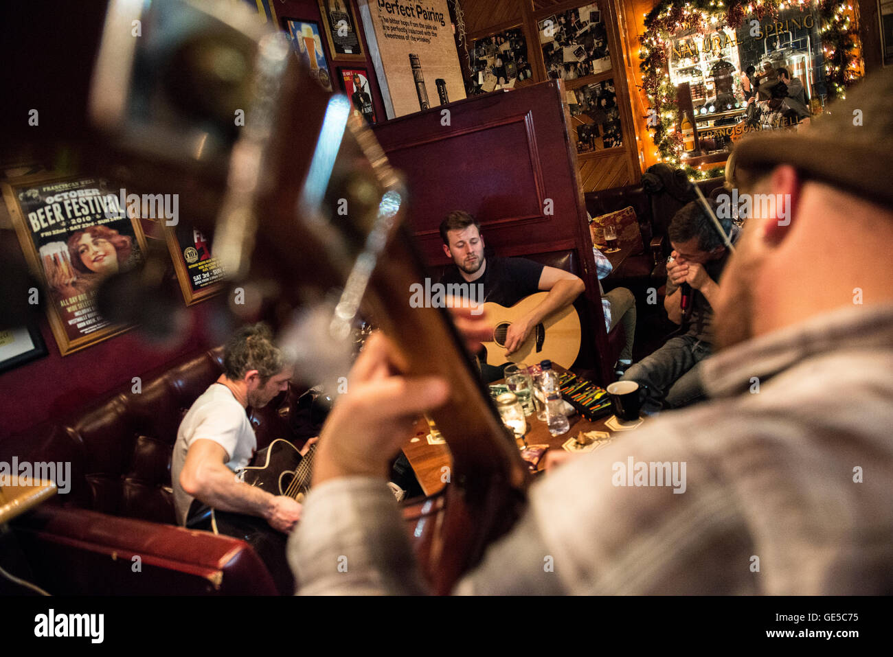 Musicians perform inside a pub, at the city of Cork in southern Ireland