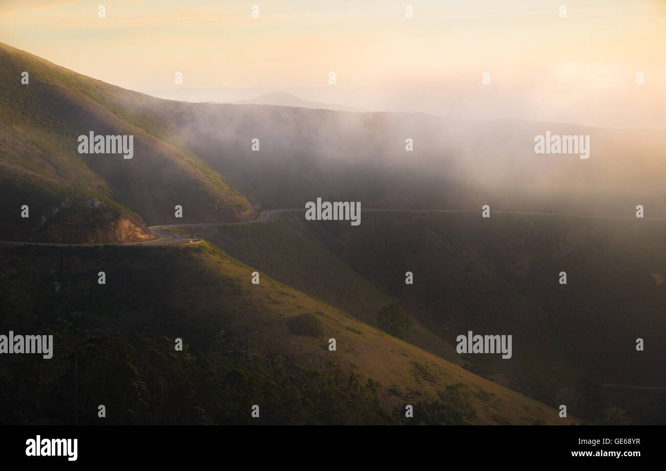 Road on the mountain in the early morning with lightly fog Stock Photo ...