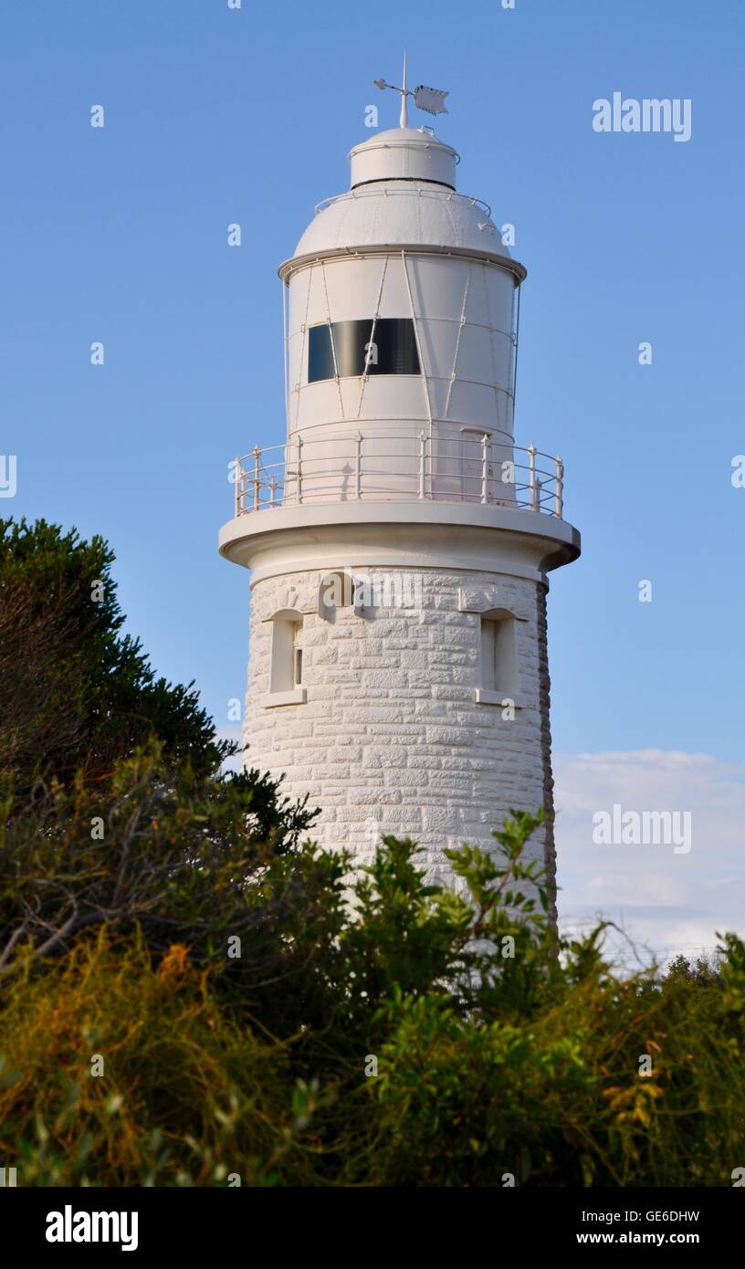 White portion of the limestone Woodman Point Lighthouse with native