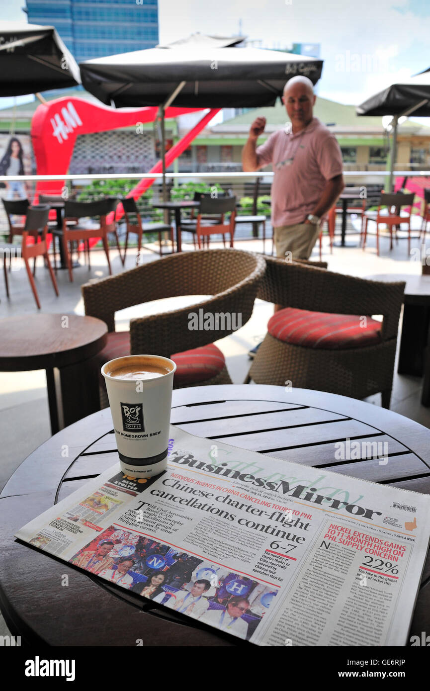 Daily newspaper at Bo's Coffee shop Ayala Center Cebu City Philippines Stock Photo