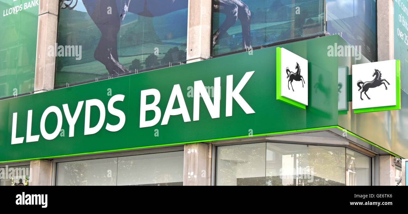 Close up front elevation fascia sign and logos above Lloyds Bank plc branch premises on corner site in London Oxford Street England UK Stock Photo