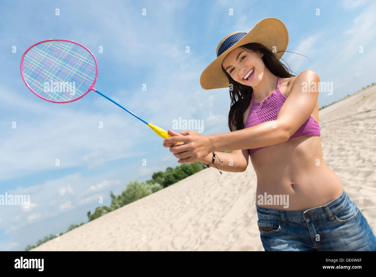 Nice sporty woman playing badminton Stock Photo - Alamy