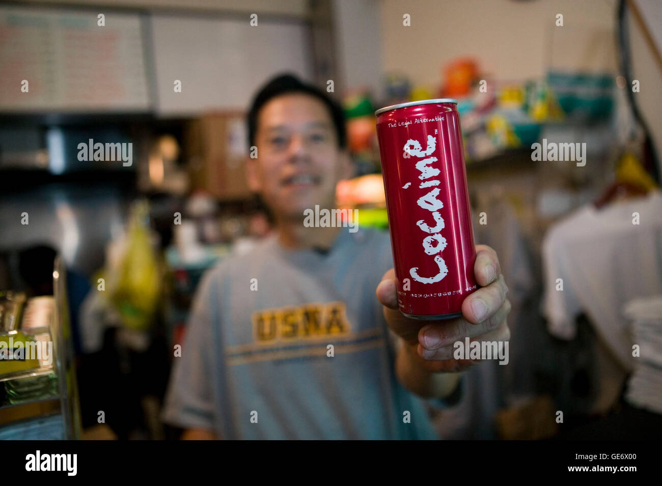 A store owner holds up a can of a controversial new energy drink