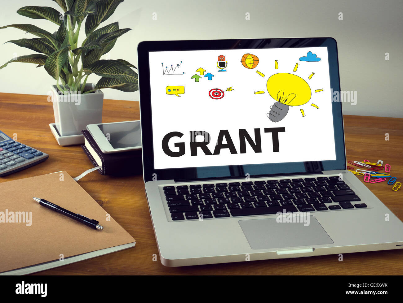 GRANT Laptop on table. Warm tone Stock Photo Alamy