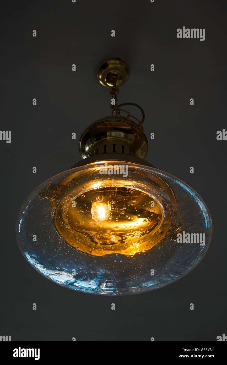 Old fashioned, antique, nautical ceiling lamp. Stock Photo