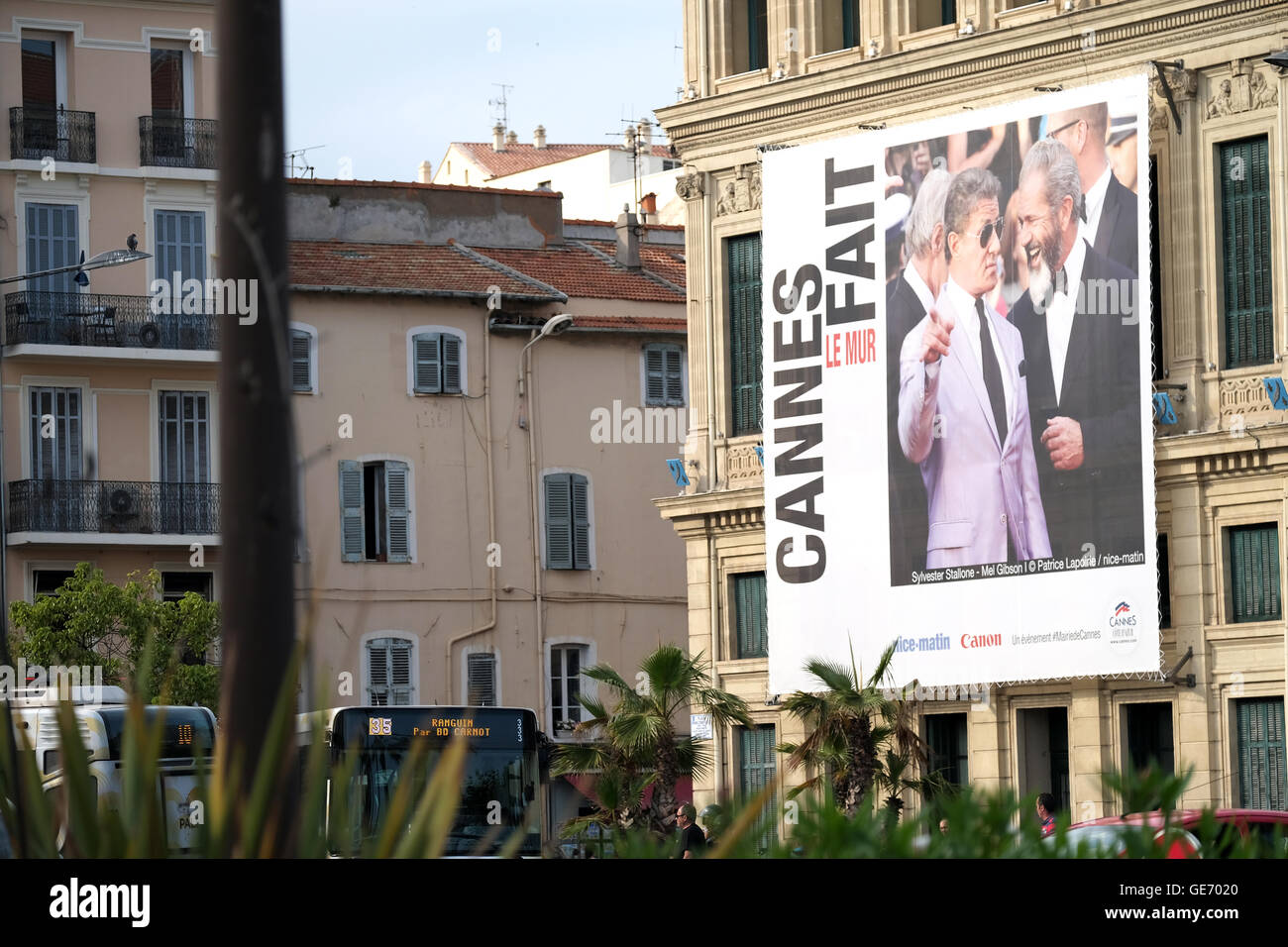 A large poster advertising the Cannes film festival on the side of a building in canees old town Stock Photo
