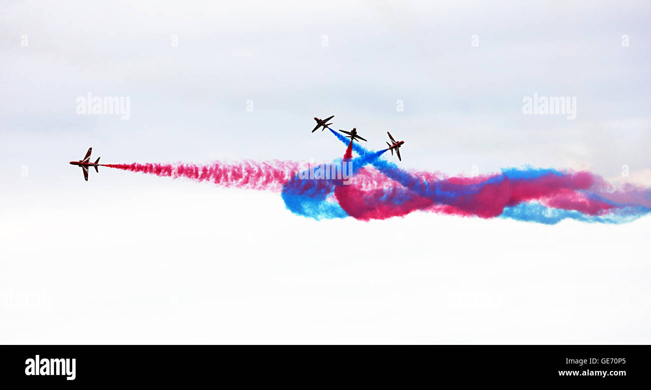 Red Arrows cross over at East Fortune Airfield.Scotlands Airshow. Stock Photo