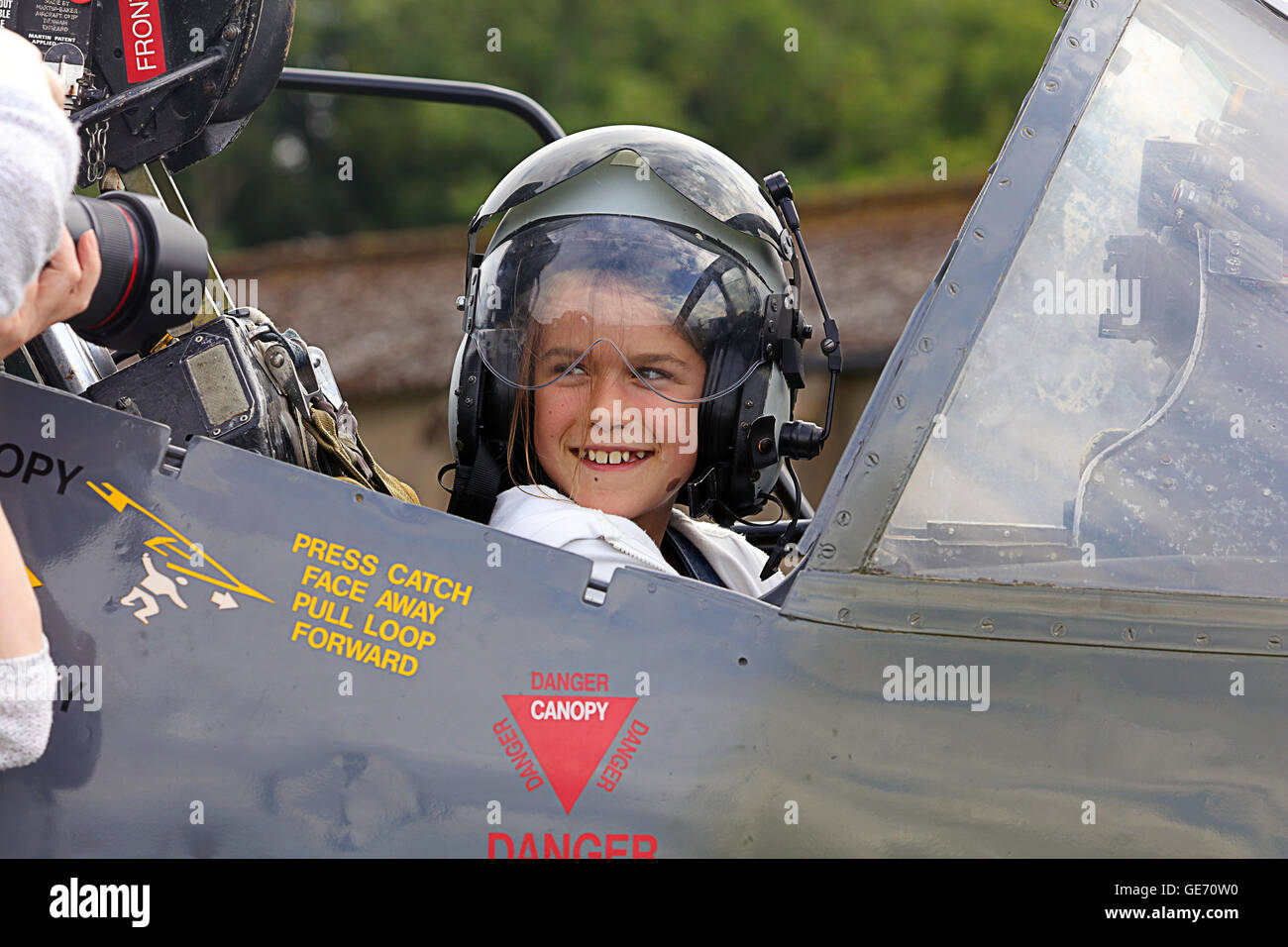Young girl in cockpit of a Harrier At Scotland's Airshow. Stock Photo