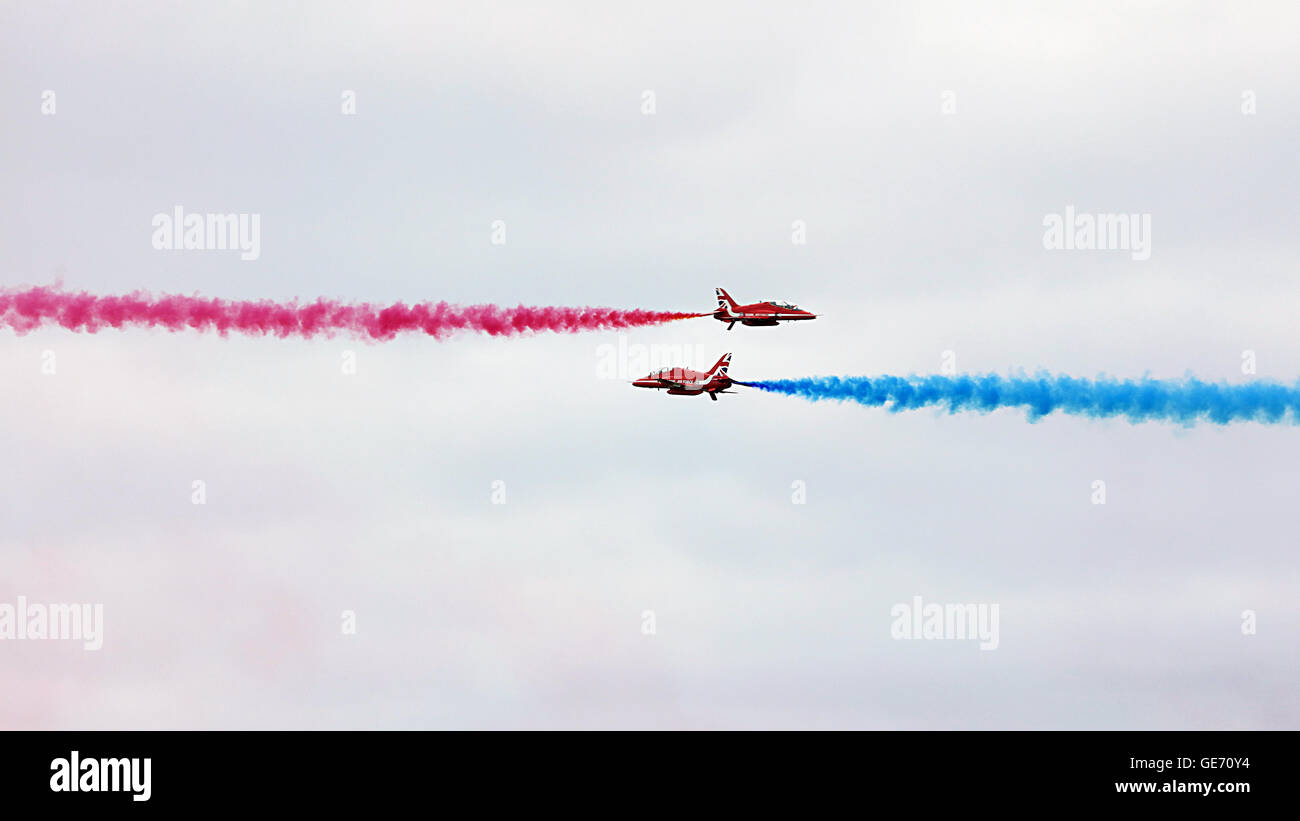 Red Arrows flying towards each other. Scotlands Airshow Stock Photo