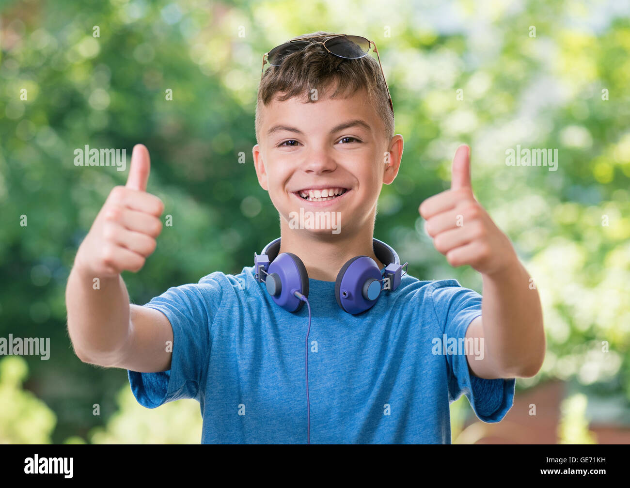 Boy showing thumbs up Stock Photo Alamy