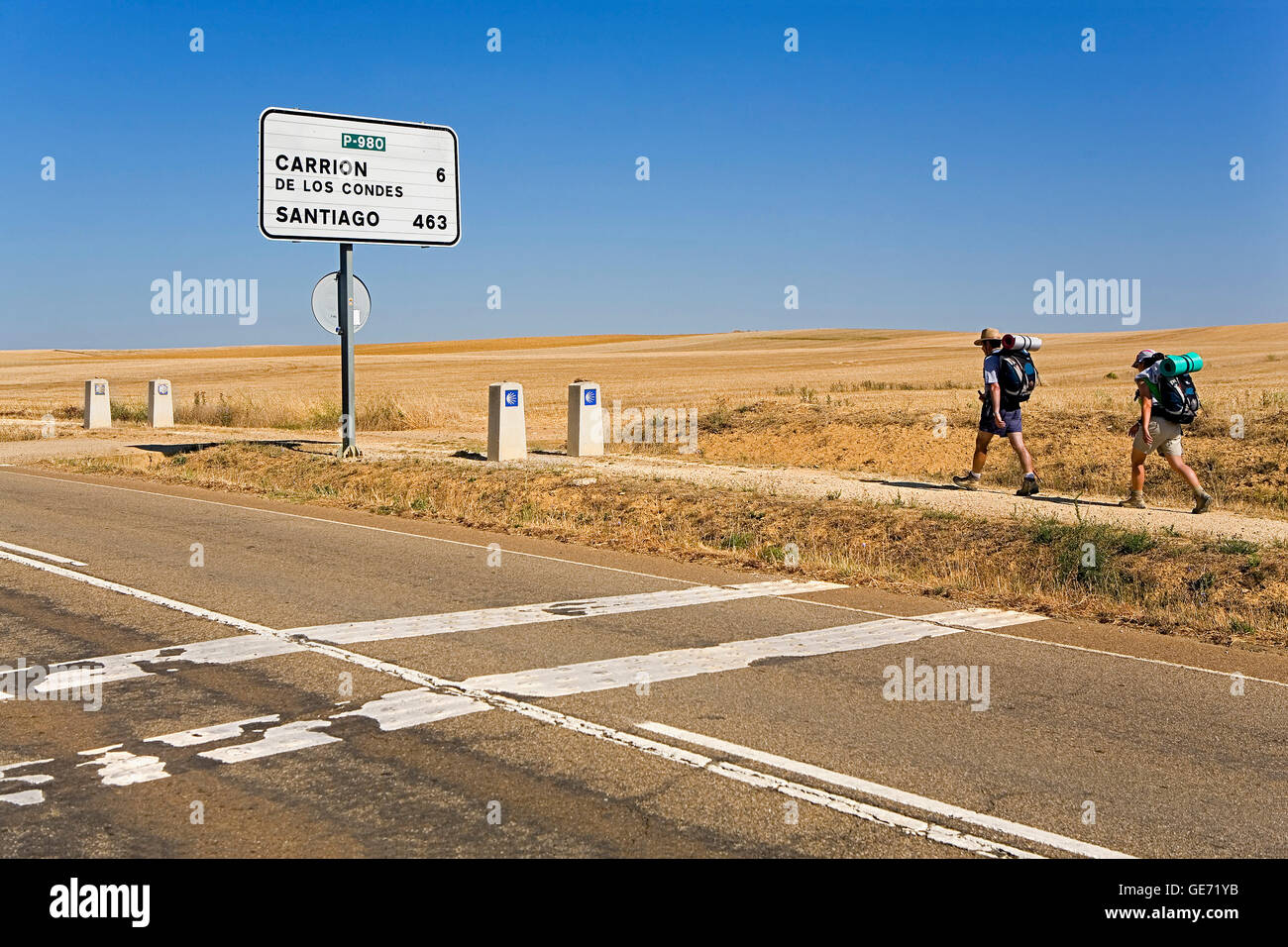 Signposting and pilgrims near Villalcázar de Sirga.Palencia province.Spain. Camino de Santiago Stock Photo