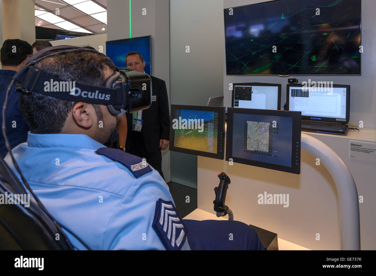 The stand of the company Airbus Defense & Space. A military in glasses Oculus Rift at the console flight simulator Sferion. Stock Photo