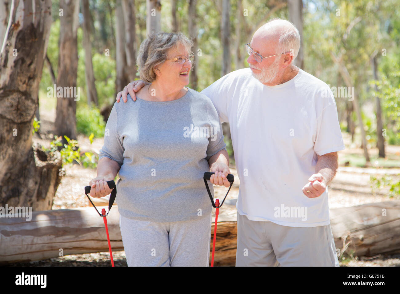 Happy Healthy Senior Couple Exercising Outside Together. Stock Photo