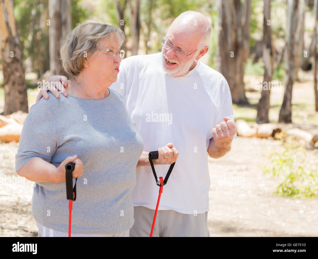 Happy Healthy Senior Couple Exercising Outside Together. Stock Photo