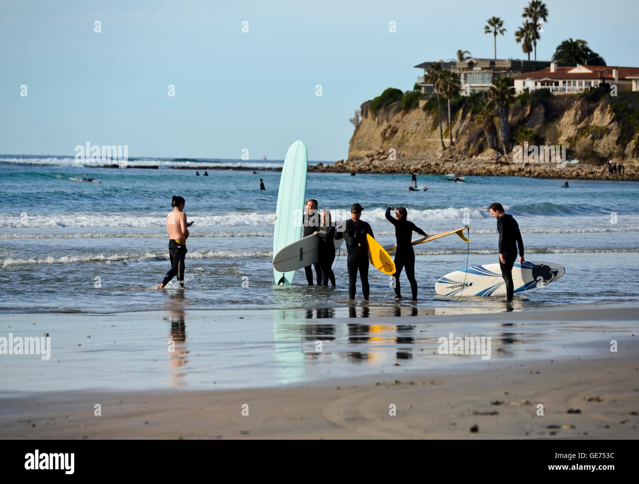 A group of surfers on a beach in San Diego, California Stock Photo Alamy