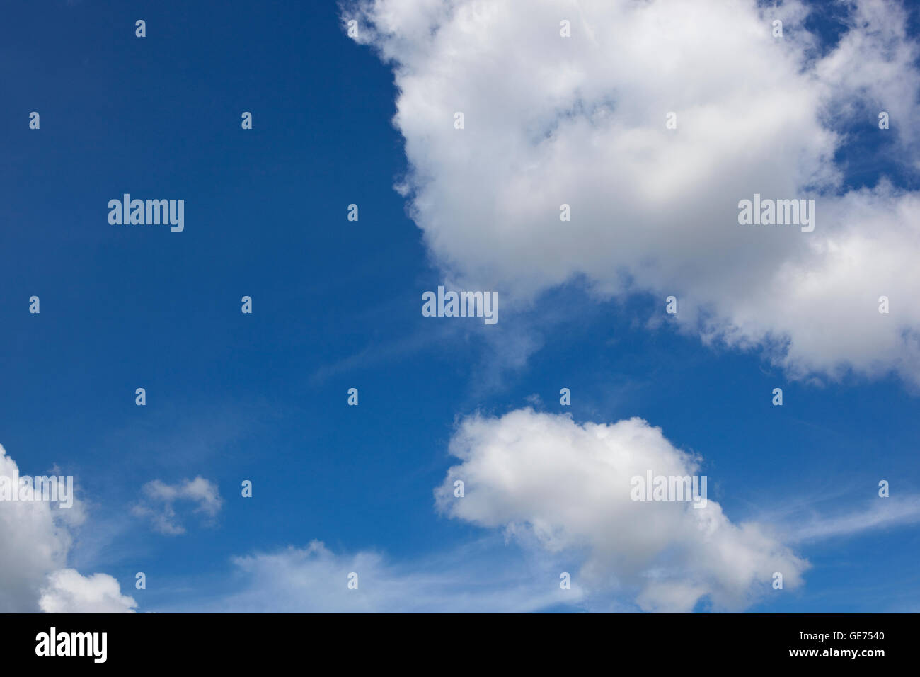 A summer blue sky background with fluffy white clouds Stock Photo - Alamy