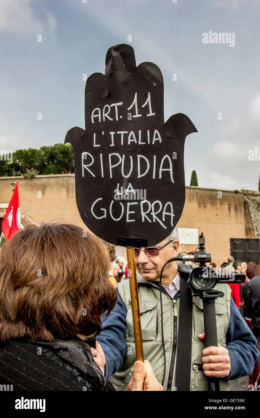 protester holds placard describing the article 11 of the Italian Constitution: Italy repudiates war Stock Photo