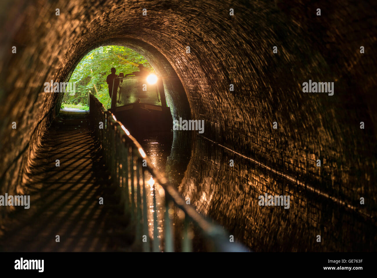 A canal boat passing through Ellesmere Tunnel on the Llangollen Canal in Shropshire. Stock Photo