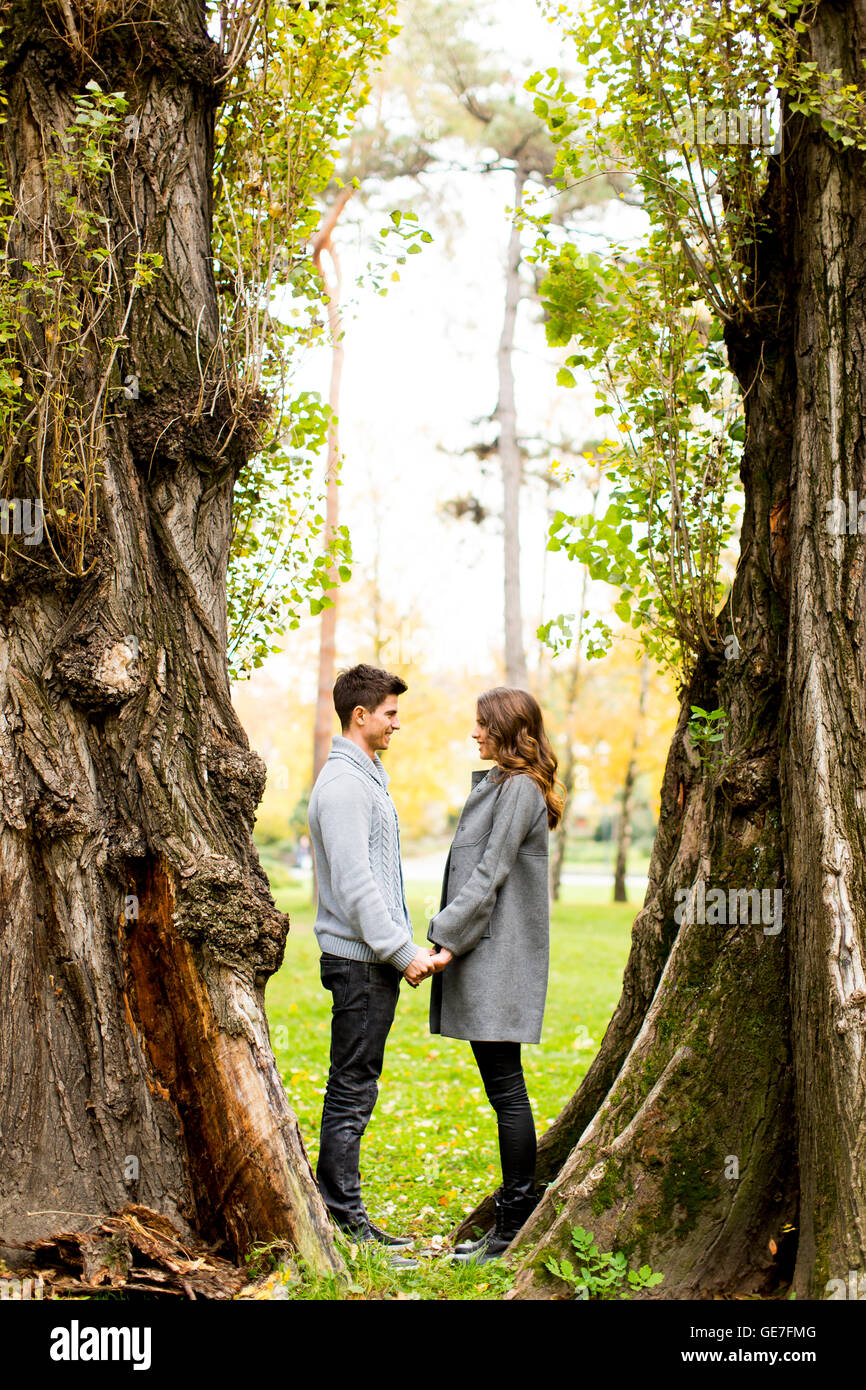 Loving young couple in the autumn park Stock Photo - Alamy