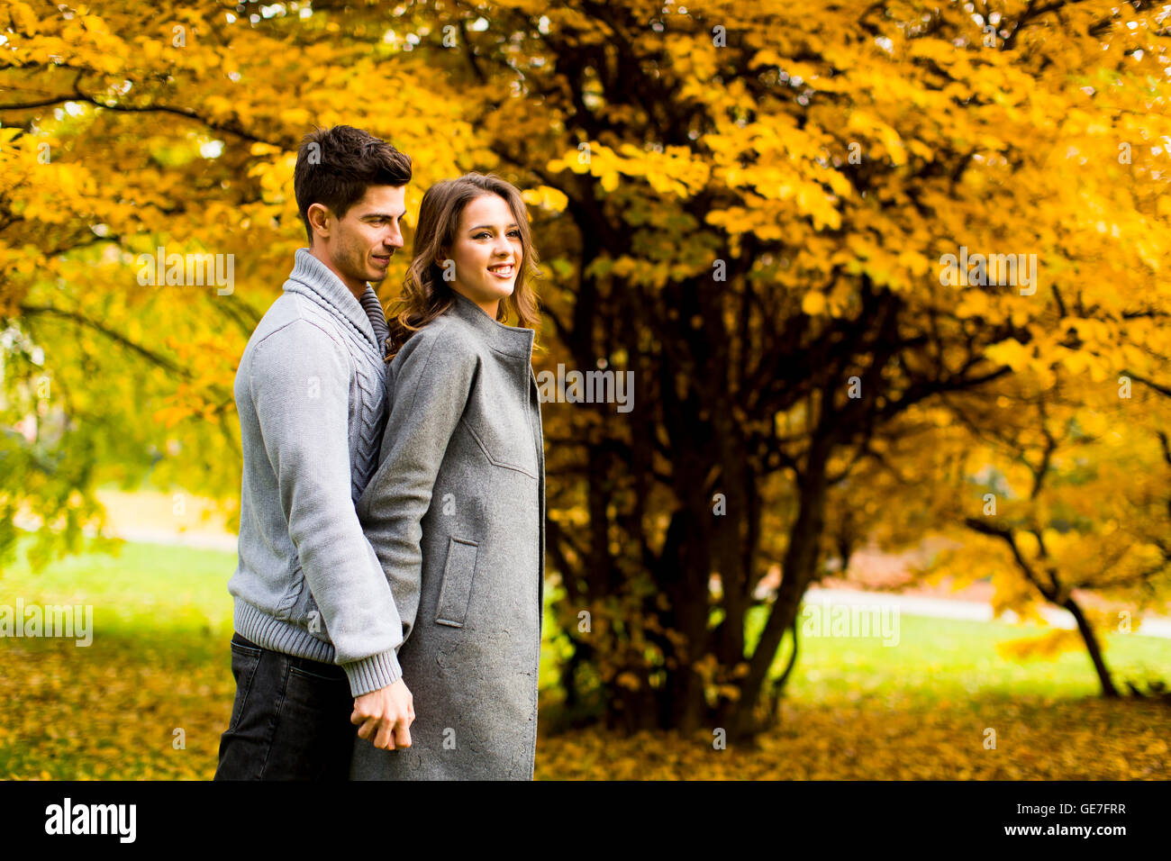 Loving young couple in the autumn park Stock Photo - Alamy