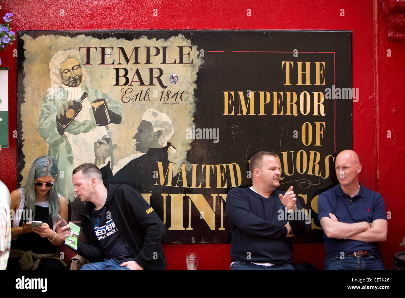 Ireland, Dublin, Temple Bar, customers sat outside pub Stock Photo