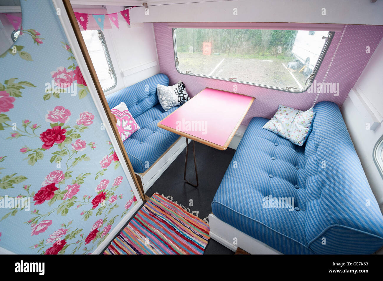 shabby chic old caravan, renovated with cath kidston interior design caravan owner, revamped for a new generation Stock Photo