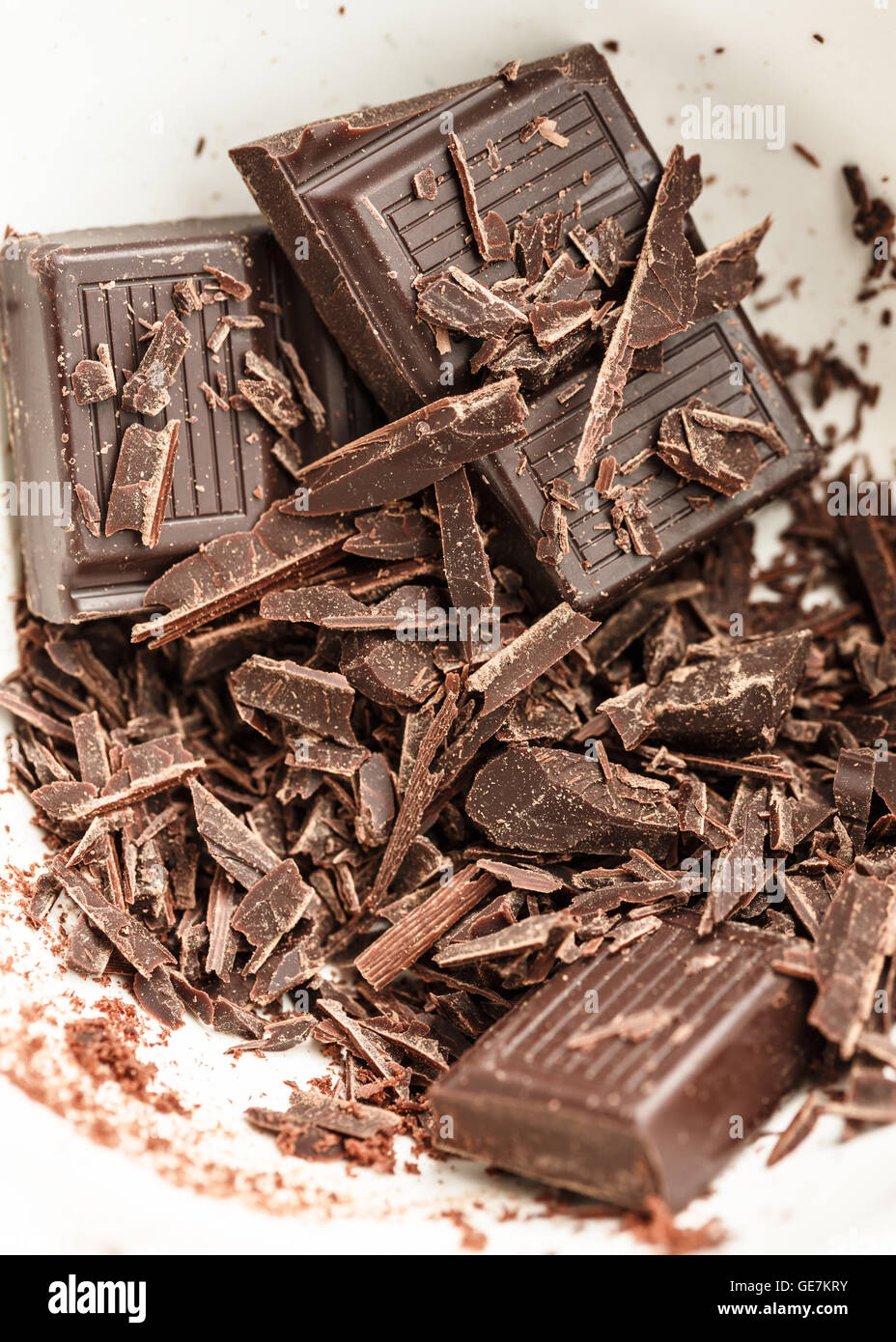 chocolate bar and shavings a white bowl Stock Photo