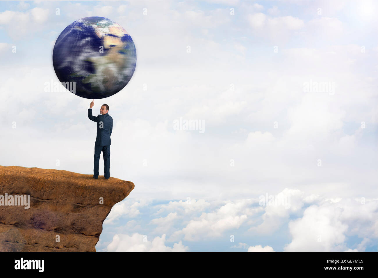 global environmental business concept businessman spinning earth on one finger Stock Photo