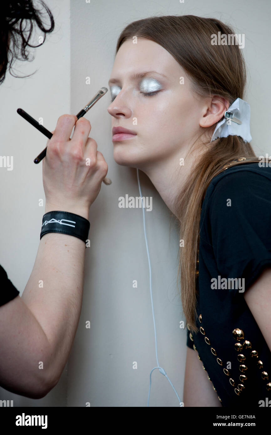 model having hair and makeup done backstage at fashionweek Stock Photo