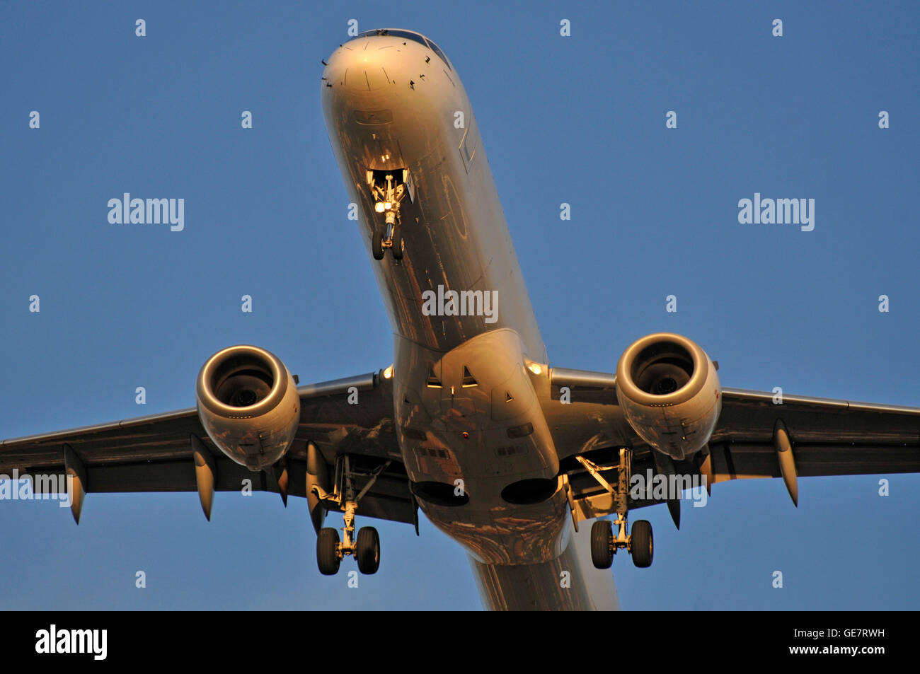 Montenegro Airlines Embraer 190 regional jet in flight / on final approach / landing gear down Stock Photo