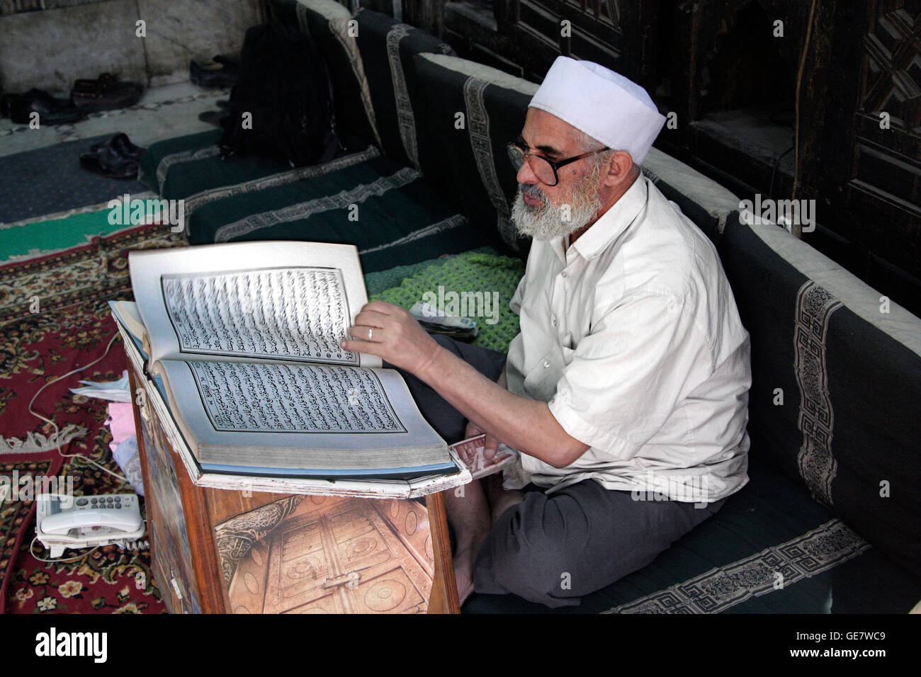 Cairo Egypt. In Egypt rich people give money(Zakat) to this former small mosque. They receive an invoice giving them points for paradise and also tax withdrawal possibilities. Poor peole are given the money and also old clothes. Especially in the days bef Stock Photo