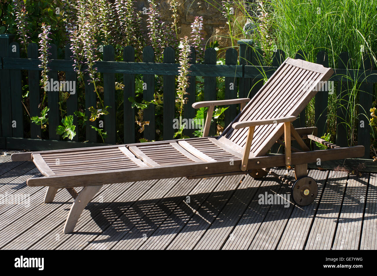 Wooden sun lounger on a summers day Stock Photo