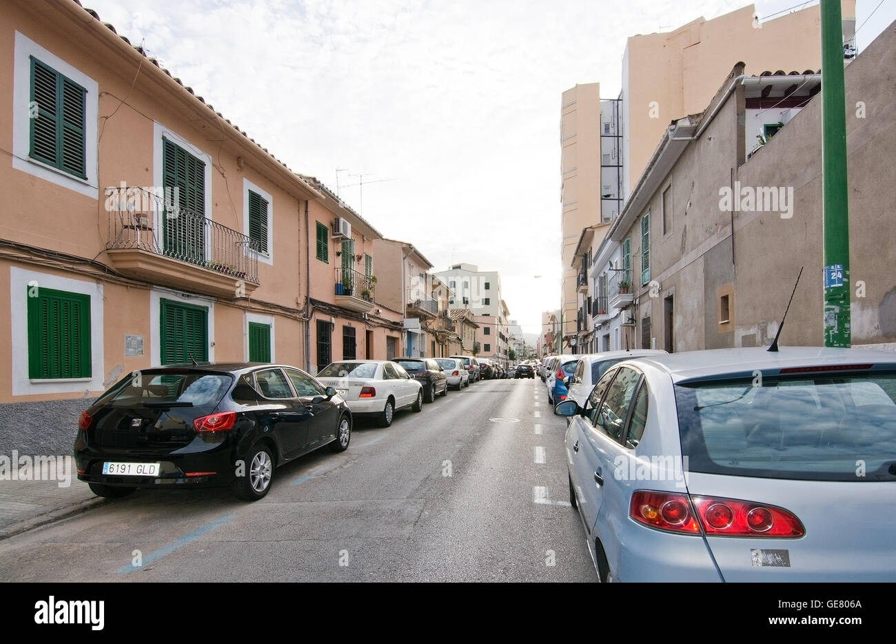 Parked cars on crowded Santa Catalina street with blue and white lines on June 30, 2016 in Palma de Mallorca, Spain Stock Photo