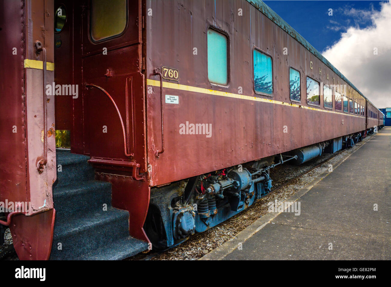 A vintage passenger train car converted to guests rooms, sits on the