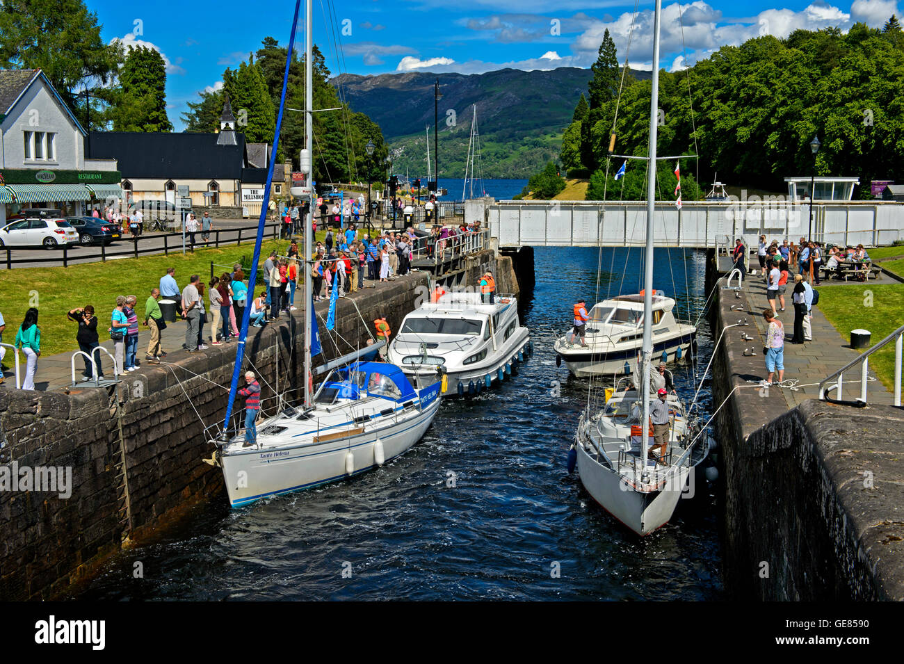 Boats in a lock in the Caledonian Canal at the mouth into Loch Ness, Fort Augustus, Scotland, Great Britain Stock Photo