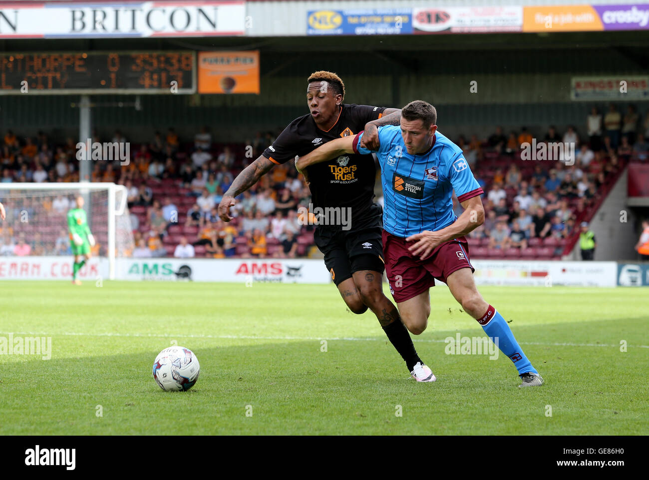 Scunthorpe United's Murray Wallace (right) and Hull City's Abel Hernandez battle for the ball the pre-season friendly match at Glanford Park, Scunthorpe. PRESS ASSOCIATION Photo. Picture date: Saturday July 23, 2016. See PA story SOCCER Scunthorpe. Photo credit should read: Richard Sellers/PA Wire. RESTRICTIONS: No use with unauthorised audio, video, data, fixture lists, club/league logos or 'live' services. Online in-match use limited to 75 images, no video emulation. No use in betting, games or single club/league/player publications. Stock Photo