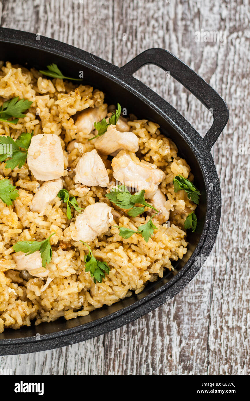 Pilaf ricecurry with chicken and salad in the form of iron Stock Photo