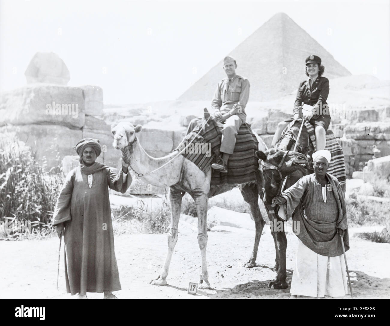 Army Officer  and Womans Army officer(WAC) on Camels , Great Pyramids  Vintage Photograph near Camp Huckstep, Egypt, World War Two, 1944 Stock Photo