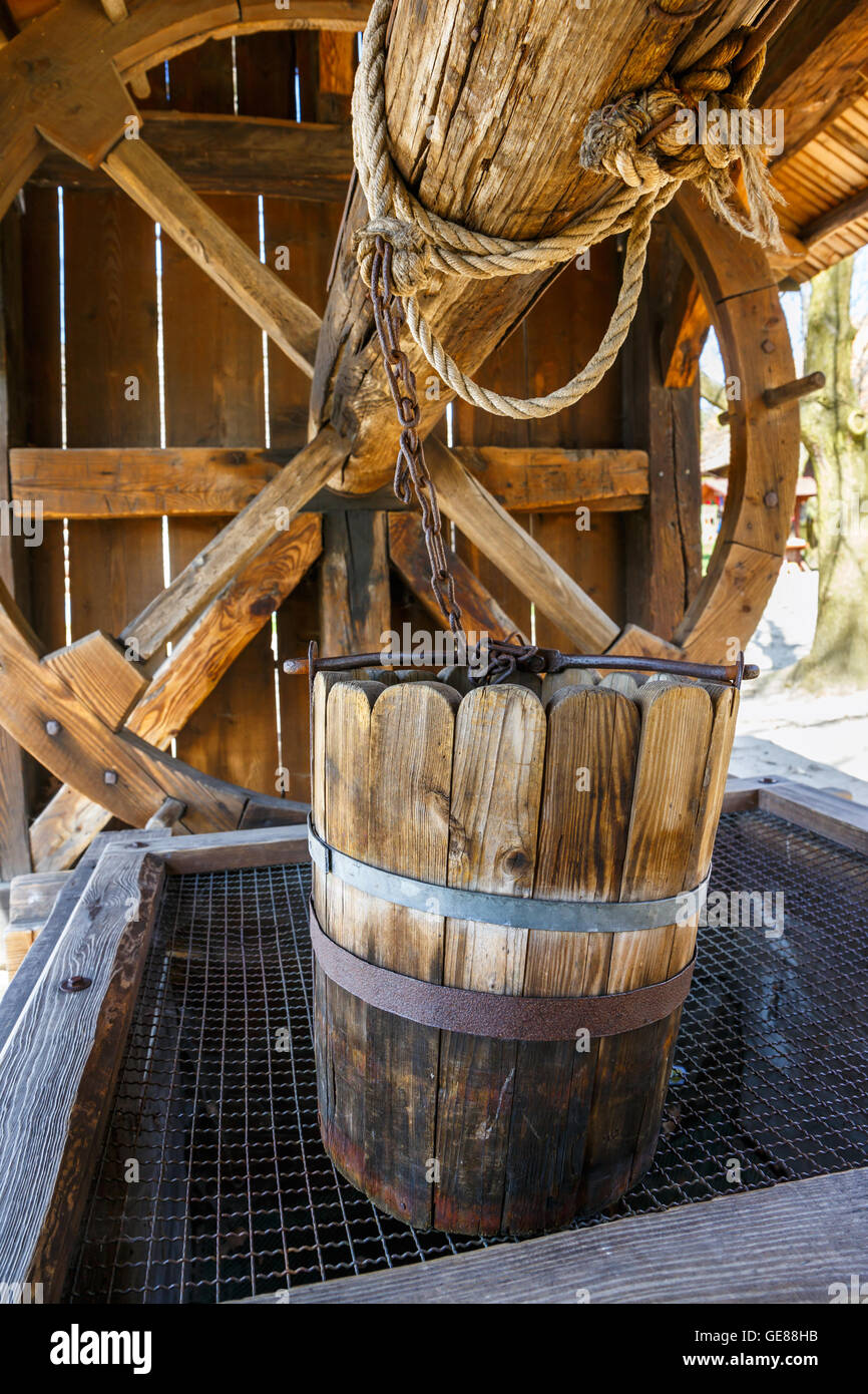 old wood bucket, water well Stock Photo Alamy