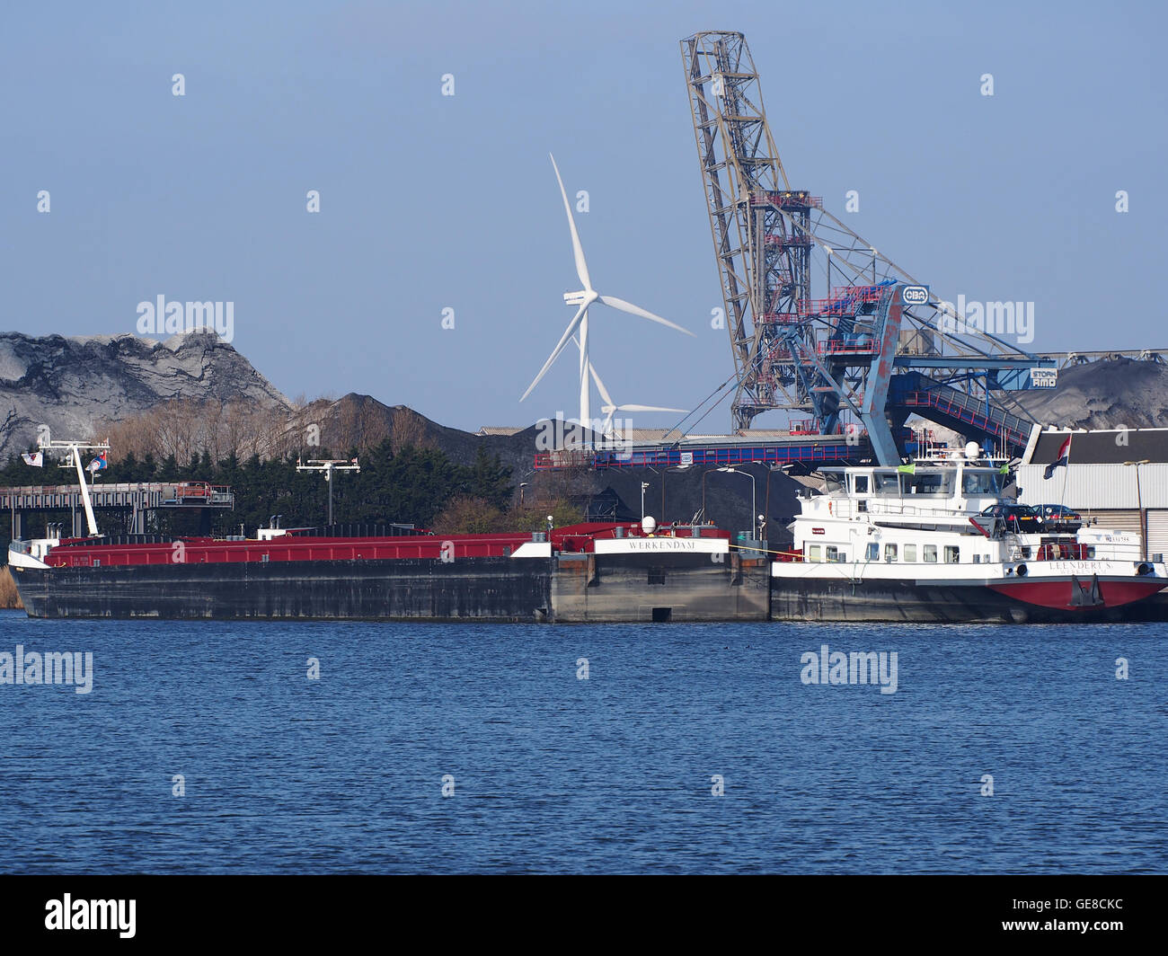 An image of the ships LEENDERT Sr and LEENDERT Sr II, both with unique ENI numbers, docked at the Port of Amsterdam. These vessels are part of the maritime operations in European waters. Stock Photo