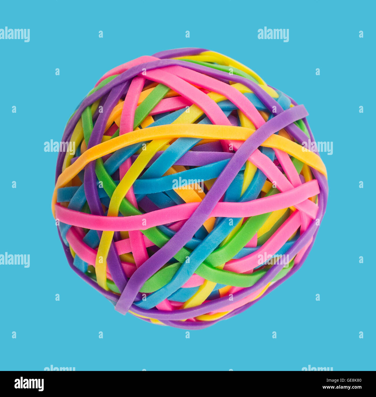 Rubber elastic band ball on light blue background Stock Photo Alamy