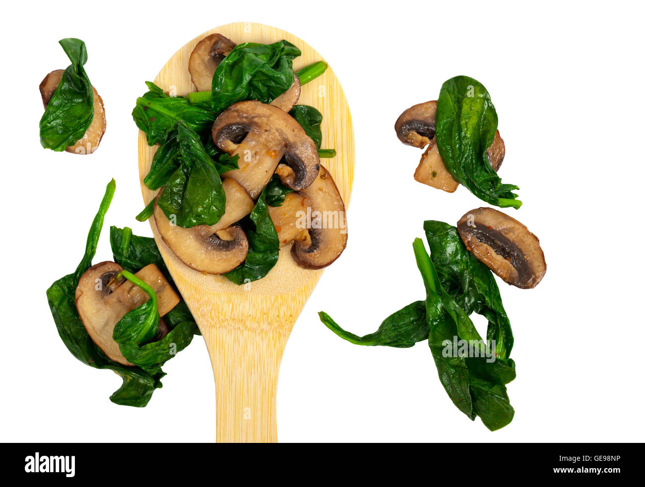 Sauteed Mushrooms and Spinach on White Stock Photo Alamy